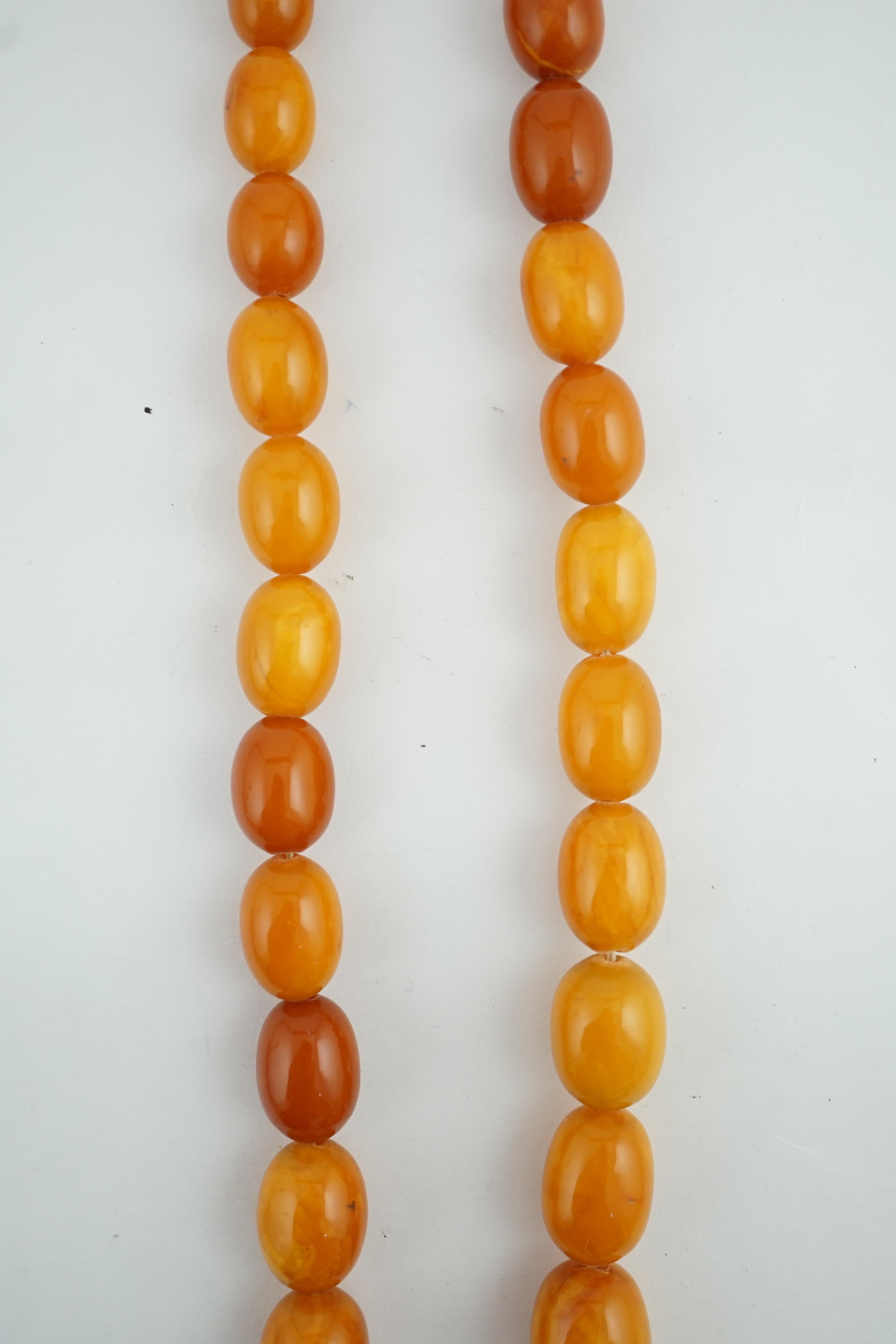 A single strand graduated oval amber bead necklace